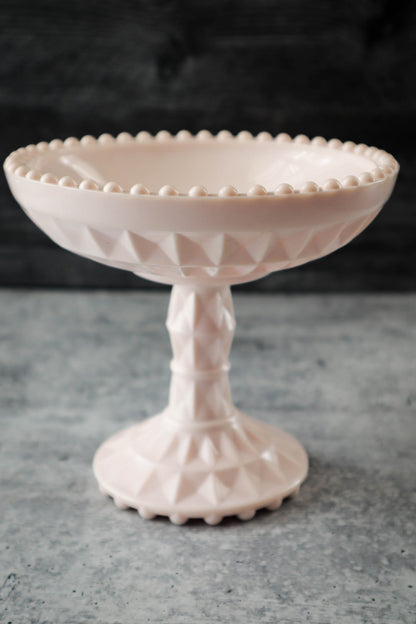 https://justdandies.co/cdn/shop/files/2366-jeanette-glass-pink-milk-glass-pedestal-bowl-compote-6.jpg?v=1689643517&width=416